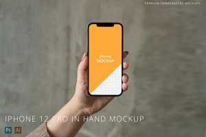 混凝土背景手持iPhone 12 Pro手机样机 iPhone 12 Pro in Hand Mockup Concrete Background